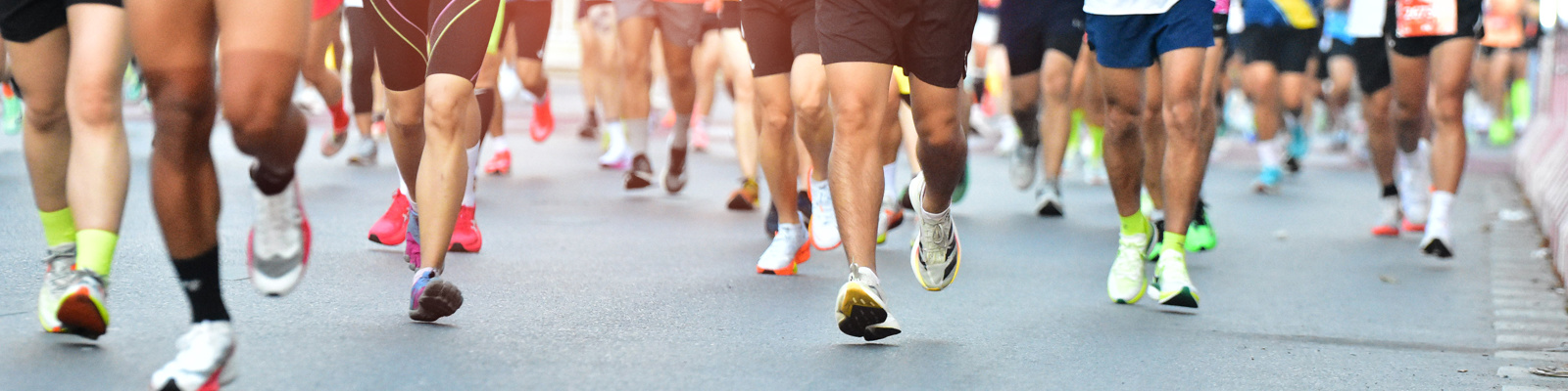 Marathon Running In The Light Of Morning, People Running On City Road Detail On Legs, Step, Walk And Outdoor Exercise Activities Concept.